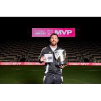 Lionel Messi with the MLS Most Valuable Player trophy