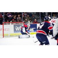 Saginaw Spirit goaltender Andrew Oke stops a Windsor Spitfires' shot