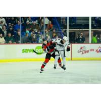 Vancouver Giants right wing Cameron Schmidt (right) vs. the Kelowna Rockets