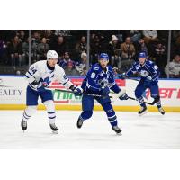 Toronto Marlies' Mikko Kokkonen and Syracuse Crunch's Gabriel Fortier in action