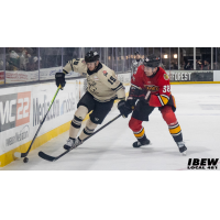 Indy Fuel defenseman Lucas Brenton (right) vs. the Iowa Heartlanders